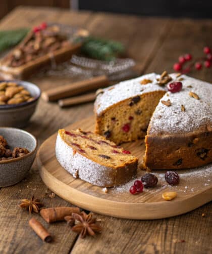 freshly baked Spelt Mulled Wine Fruitcake on a rustic wooden table